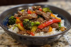 Beef stir fry with colorful vegetables in a frying pan