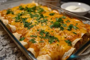 Delicious quick and easy chicken enchiladas topped with cheese and sauce