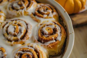 Delicious small batch pumpkin cinnamon rolls topped with cream cheese frosting