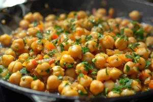 Vegan Marry Me Chickpeas served on a plate with fresh herbs